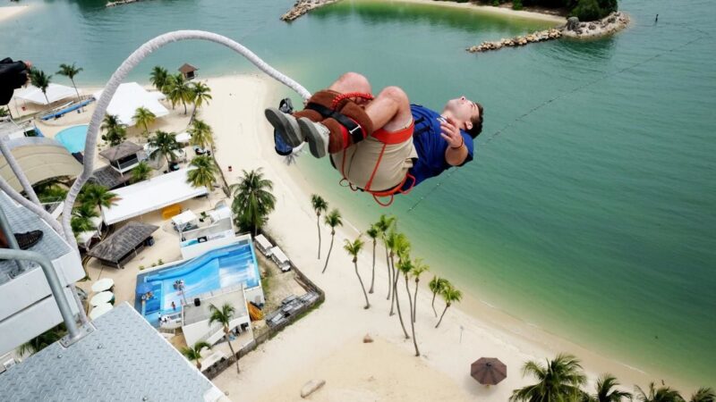 strapped to your legs, the sentosa island bungee jump is supervised by the top professional in the area - the aj hackett company